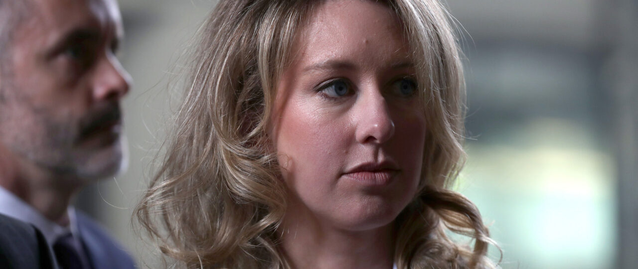 Pretend you’re sitting at Elizabeth Holmes’ desk on this weirdly detailed website