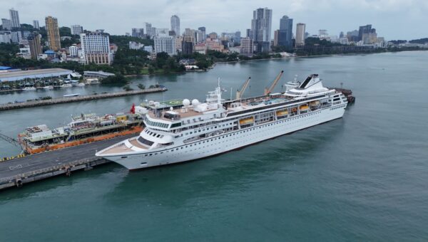 They made a cruise ship their home, then got kicked off in Cambodia. Now their dream life is on hold.