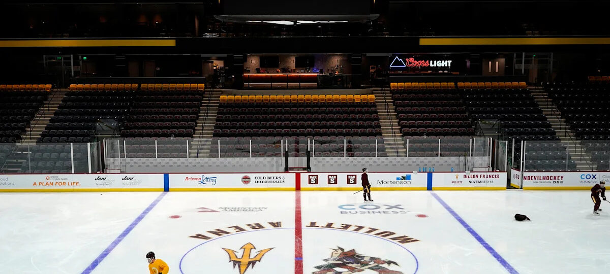 Arizona State assistant hockey coach not at opener in wake of player collapse