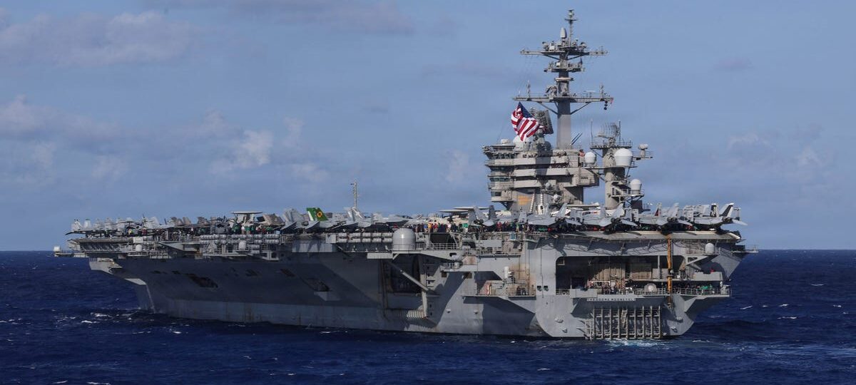 A US Navy carrier strike group just deployed with a big drone ship for the first time