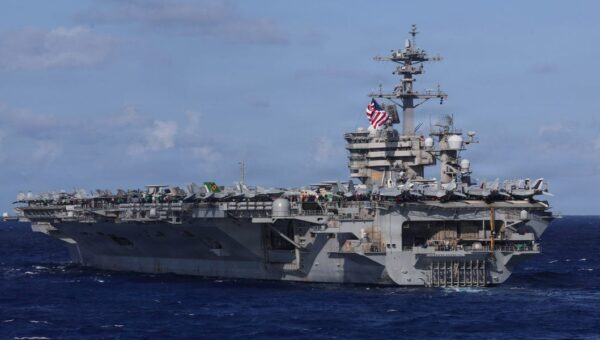 A US Navy carrier strike group just deployed with a big drone ship for the first time