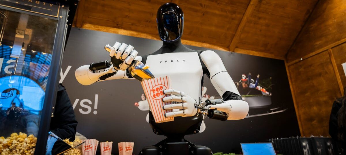 Elon Musk wrangles with the robot hand