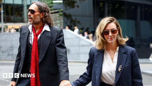 Russell Brand's wife tells his rape trial he is 'kind and a wonderful father'