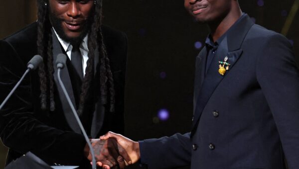 Burna Boy Suits Up to Present Bukayo Saka With the Socrates Award at the 2026 Ballon d’Or