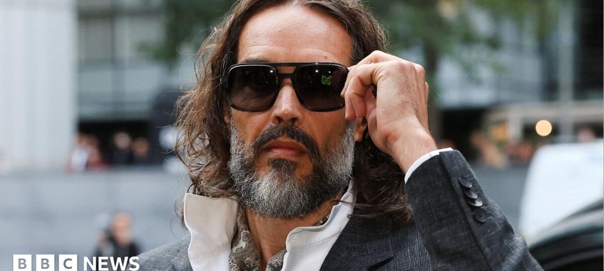 Russell Brand arrives at court for start of rape trial