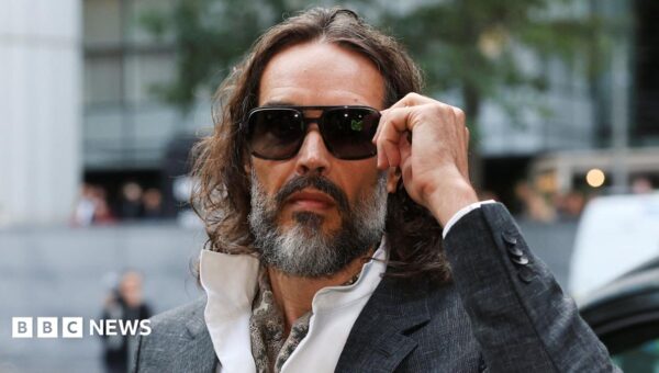 Russell Brand arrives at court for start of rape trial