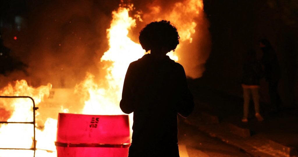Clashes break out as hundreds of thousands protest in France