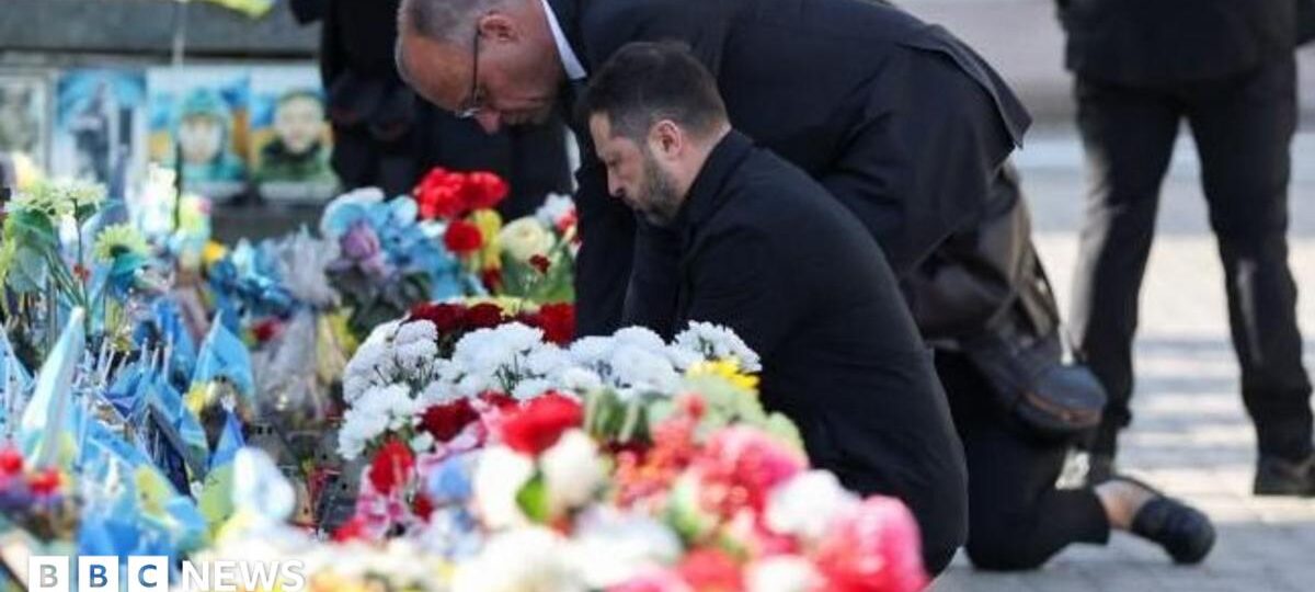 Kyiv bridge hit in further Russian drone attack as German chancellor makes surprise visit
