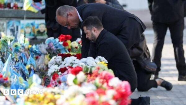 Kyiv bridge hit in further Russian drone attack as German chancellor makes surprise visit
