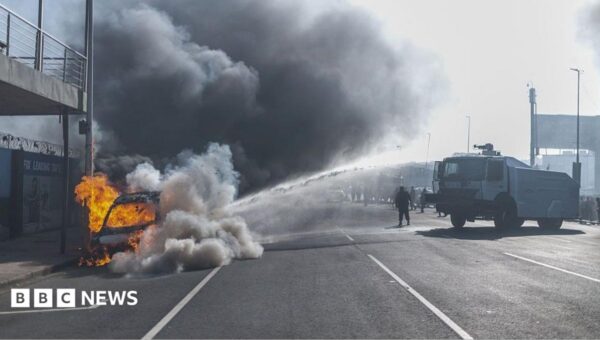 Cars torched and shops looted as anti-migrant violence erupts in South Africa