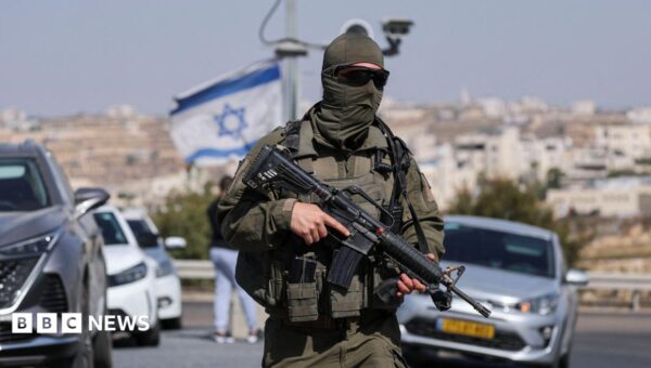 Five Israelis wounded and two suspected Palestinian attackers killed in West Bank shooting