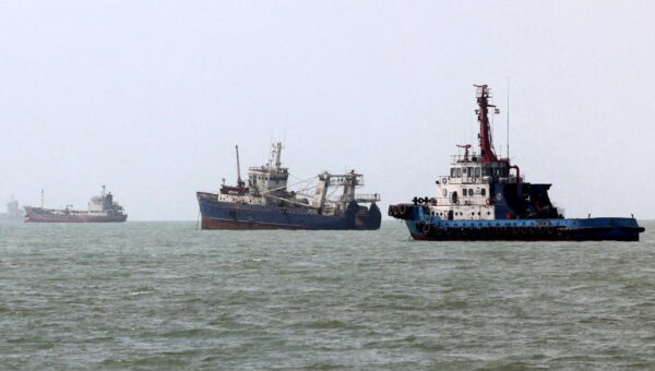 Iran Guards says three tankers on fire after hitting mines in Hormuz