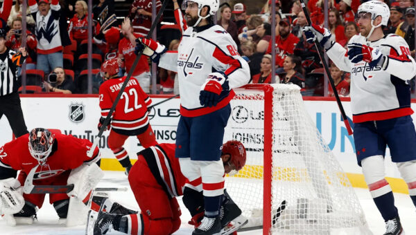 Tuch scores twice in his first game for Washington, helping the Capitals beat the Hurricanes 5-2