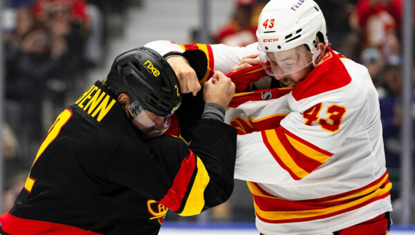 Merilainen makes 23 saves in first start for the Canucks in a 4-1 victory over the Flames