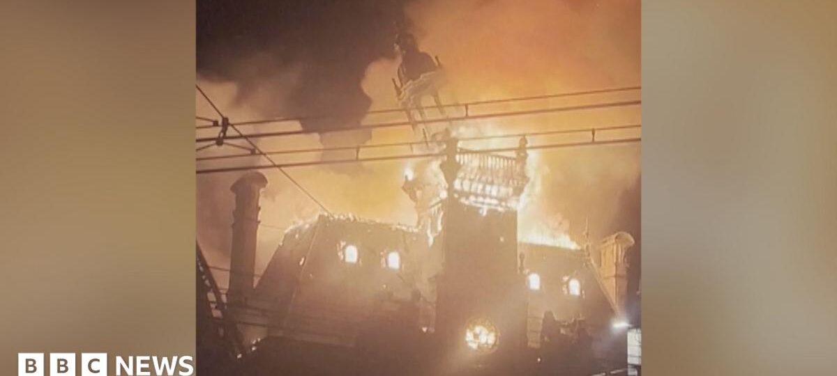 Watch: Moment historic French town hall spire collapses in flames amid protests