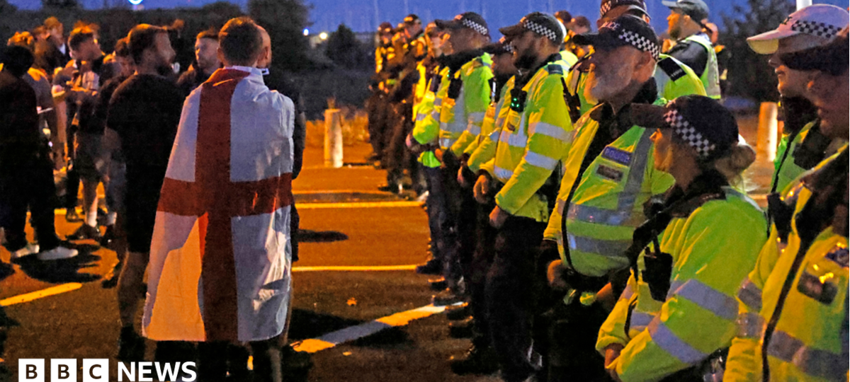 Protesters scuffle with police as migrants brought ashore on south coast