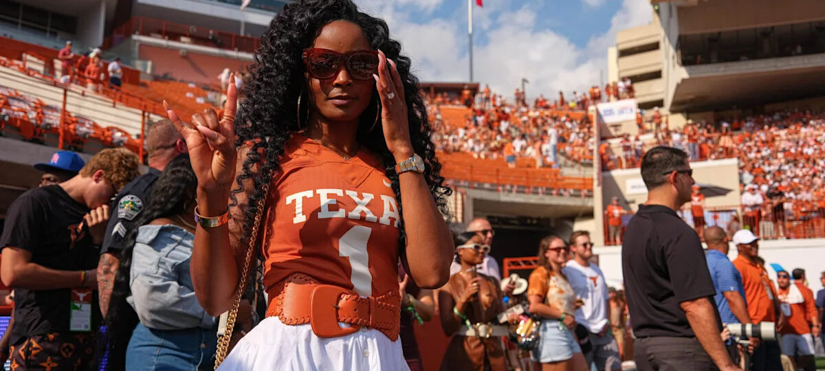 Loreal Sarkisian turns heads in flashy cowgirl sideline fit, Louboutin boots